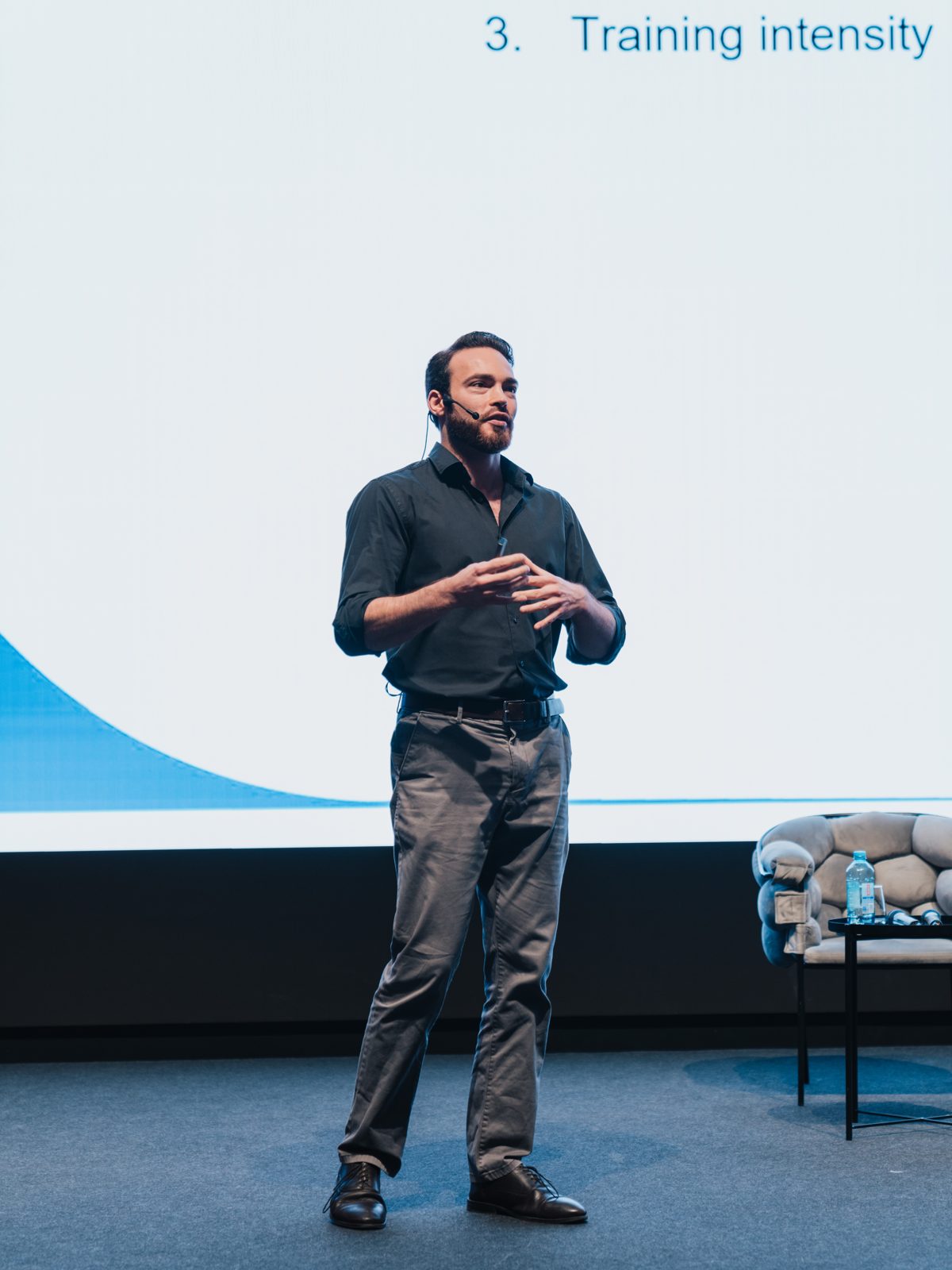 Menno Henselmans teaching at a live international seminar.
