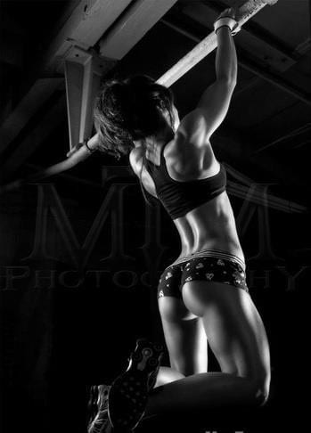 Premium Photo  A young muscular woman doing hard training for her